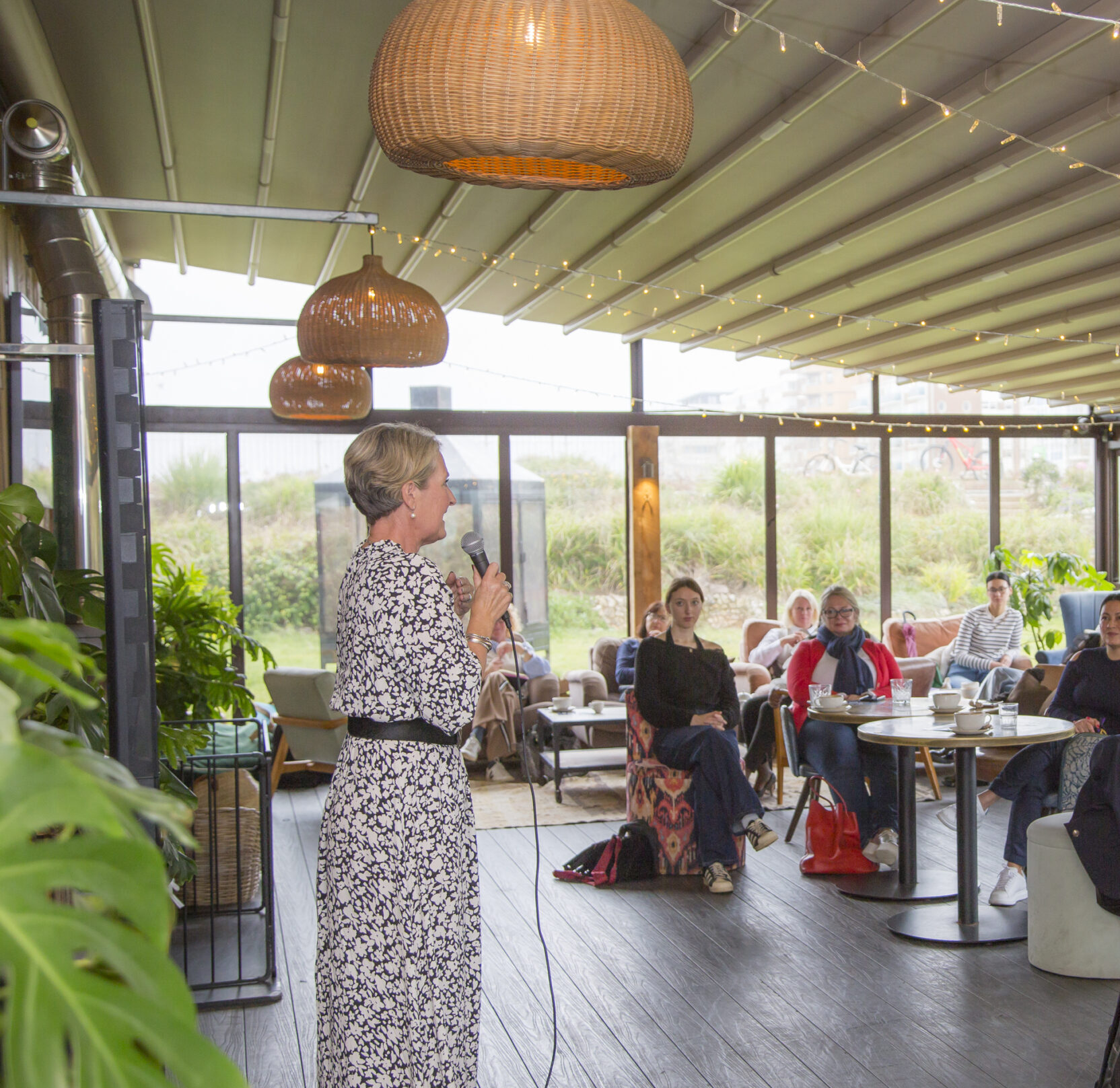 person running a workshop in a cafe