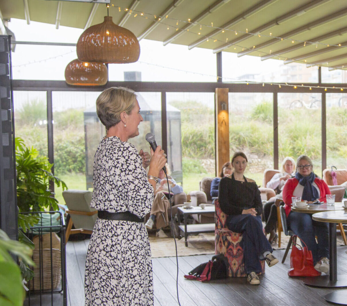 person running a workshop in a cafe
